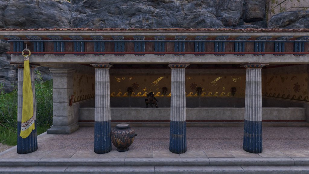 A long open building with a single line of doric columns. The back wall is gilded with scenes of marine life and four lion heads spout water into a long basin. 