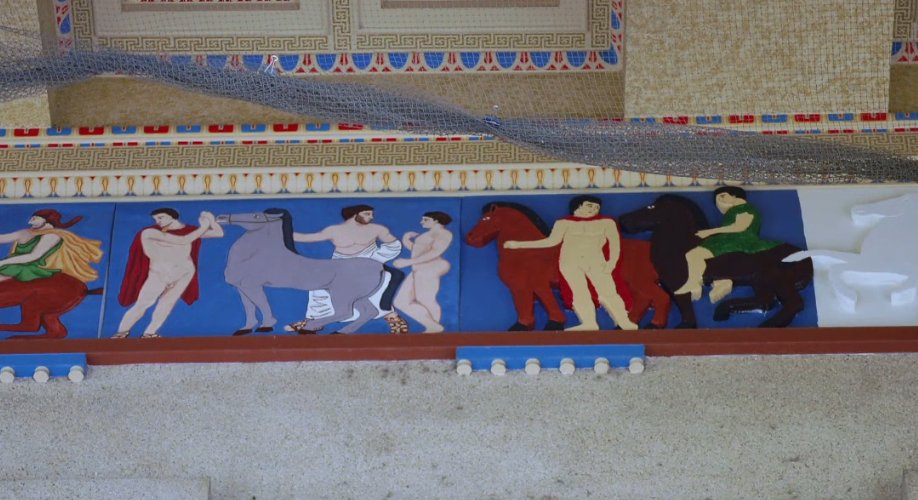 Colored replicas of the Parthenon frieze blocks. Two are 2D, and three are #D, with one uncolored. 